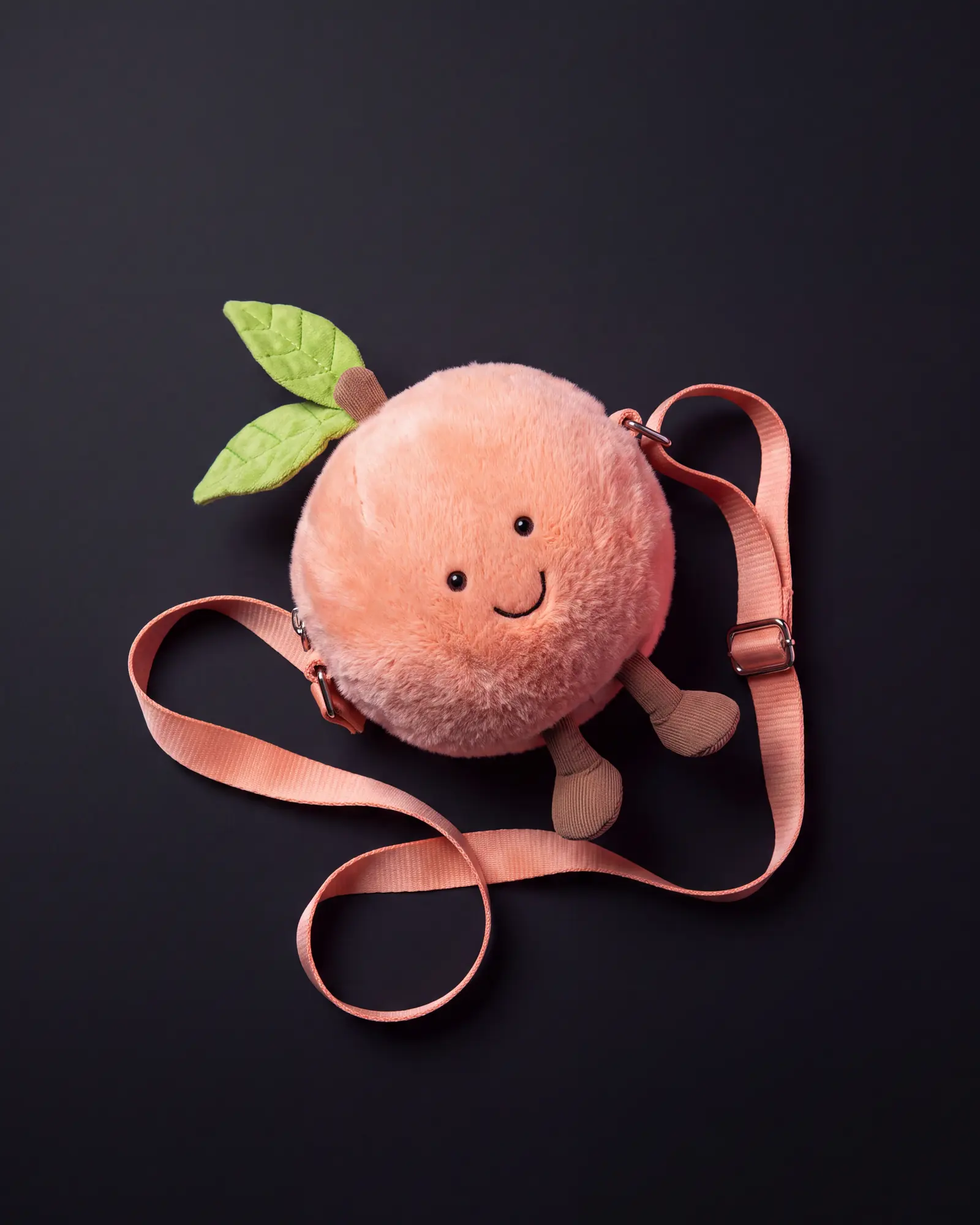 Amuseables Peach Shoulder Bag on a dark studio background.