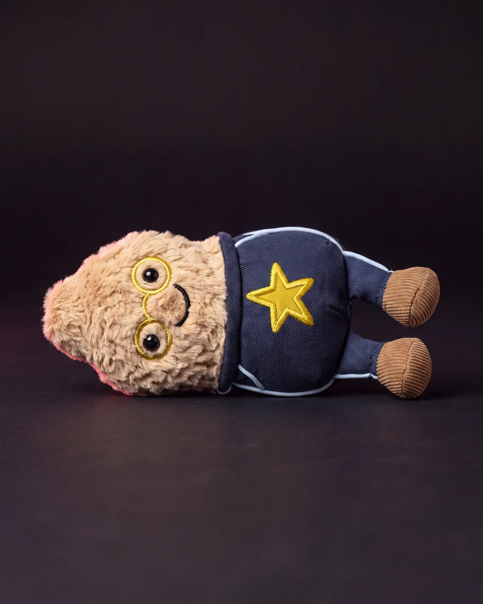 Amuseables Peanut ‘Star Student’ on a dark studio background.