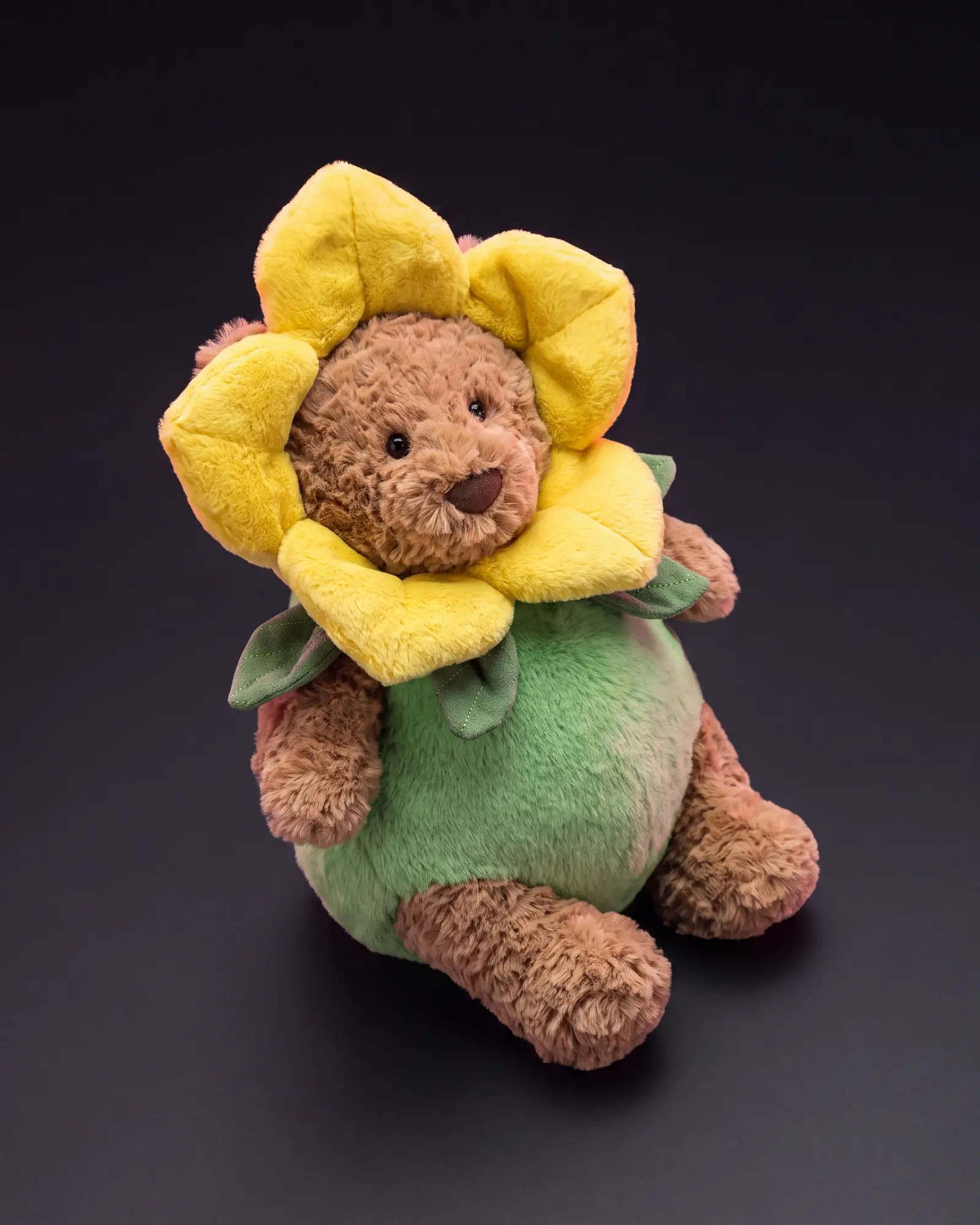 Bartholomew Bear ‘Daffodil’ on a dark studio background.