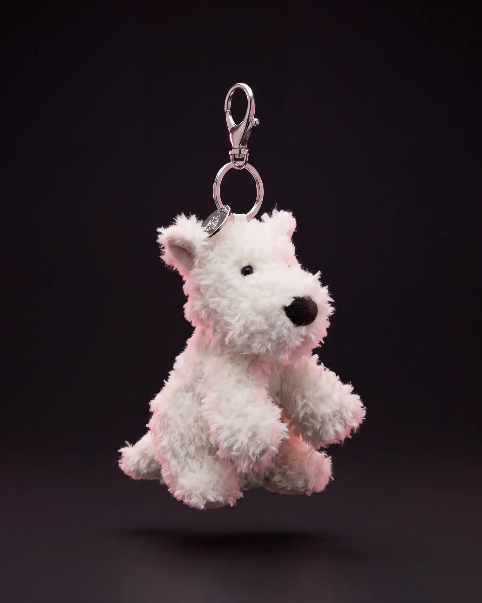 Munro Scottie Dog Bag Charm on a dark studio background.
